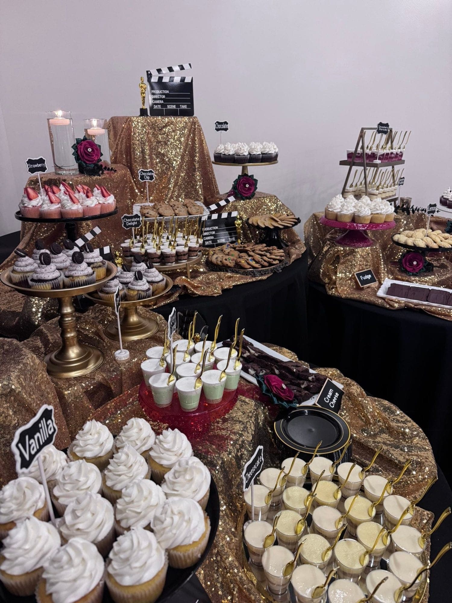 A gold Hollywood-theme dessert bar