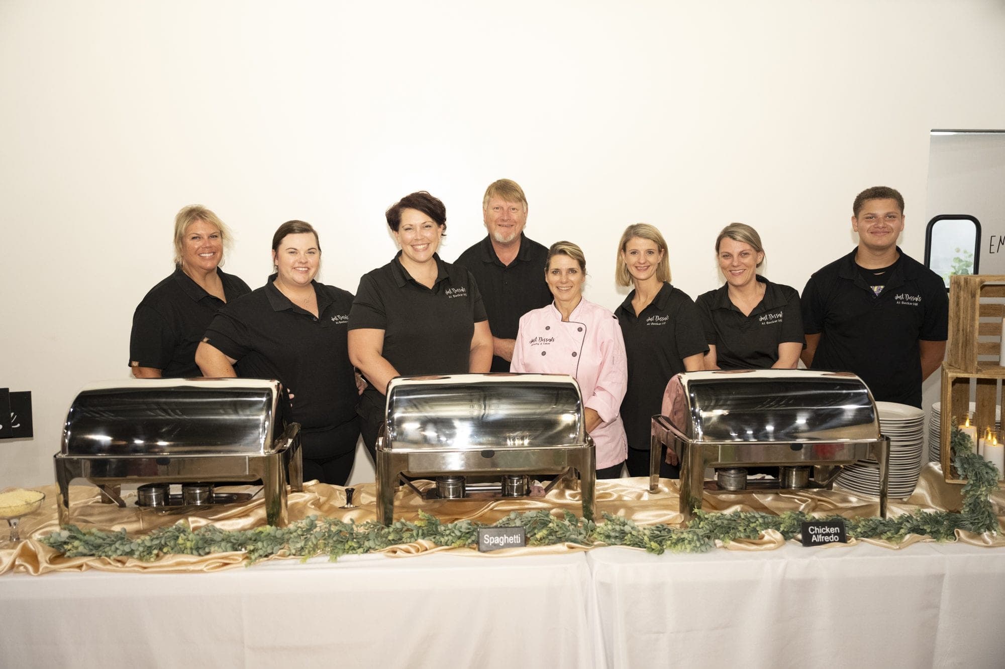 The Just Desserts team lined up behind a full buffet line